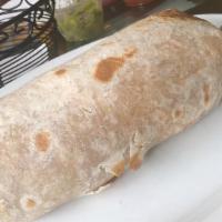 Machaca Burrito · Slow roasted pork scrambled with eggs, onion and tomato with rice, refried beans and cheese ...