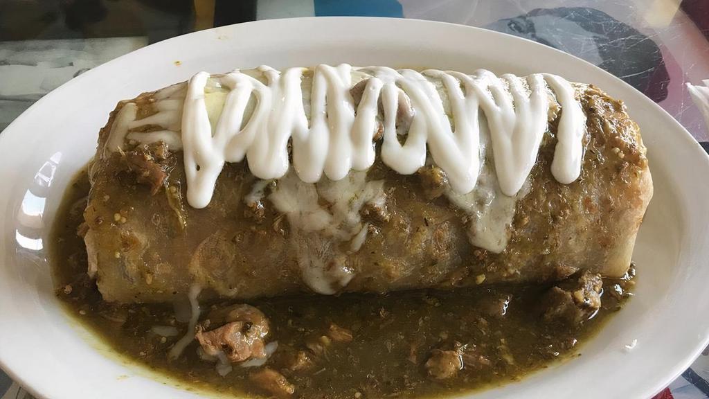 Burrito de Chile Verde · Pork cooked in a spicy green sauce with whole beans and rice.
