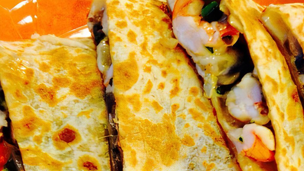 Prawn & Veggie Quesadilla · Grilled prawns with pasilla peppers, onions and mushrooms with melted Monterey jack cheese. Add sour cream and guacamole with extra charge.