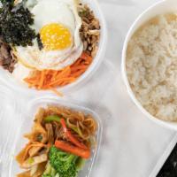 11. Bibimbap · Assorted veggies with beef and and fried egg on on top.