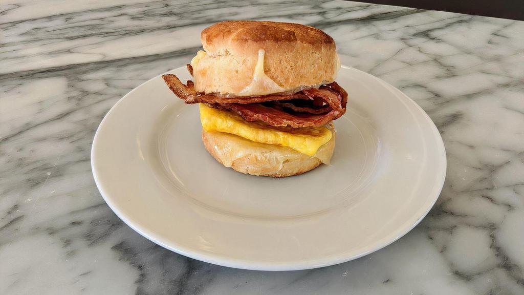 Bacon, Egg, & Cheese Biscuit · Housemade buttermilk biscuit sandwich with 1 scrambled egg, Hobb's bacon, and melted cheddar.