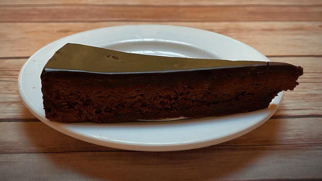 Chocolate Torte · Simple, elegant and timeless, like a little black dress. When you crave a knock-out chocolate punch in an unassuming delivery, the flourless chocolate torte is for you. 🅥=Vegetarian  🅖=Gluten-Free