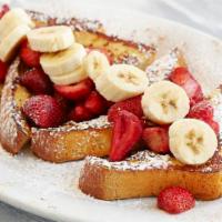 French Toast w Fruit · Dipped in vanilla egg batter with cinnamon and brown sugar
With strawberries and bananas