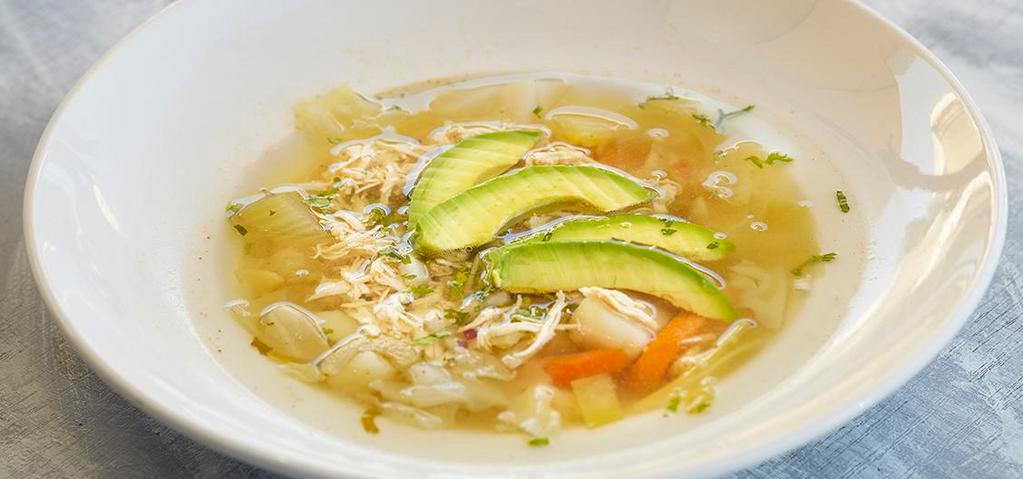 Chicken Vegetable Soup · Chock full of chicken, cabbage, celery, carrots, potatoes, onions and cilantro. Topped with avocado.
