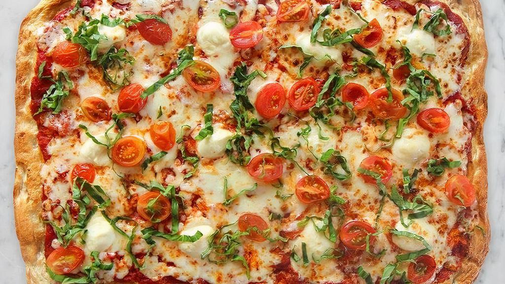 Pizza Bruschetta · Ciliegine fresh Mozzarella, grape tomato, with sweet and savory pizza sauce garnished with chiffonade basil.