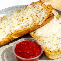 Garlic Bread With Cheese · Freshly baked garlic bread topped with mozzarella cheese.