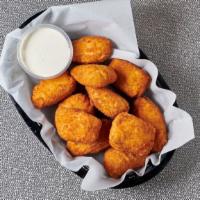 Jalapeno Poppers (8 Pcs) · Juicy jalapeno poppers breaded and filled with cheese and fried to golden perfection.
