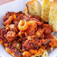 Jambalaya Pasta · Spicy. Penne with Cajun sausage, chicken breast, shrimp, bell peppers, onion, mushrooms, and...