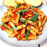 Pasta Pomodoro · Penne pasta, tomatoes, basil, and garlic in a tomato pasta sauce.