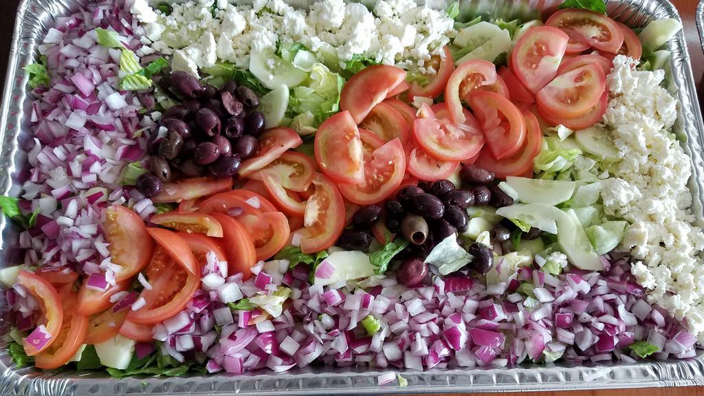 Greek Salad · Romaine lettuce, kalamata olives, cucumbers, feta cheese, red onions, tomatoes, and Italian dressing.