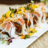 Warriors Roll · tuna and cucumber inside with White tuna on top. served with homemade mango pico de gallo mi...