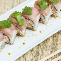 Coco Roll · shrimp, tempura and snow crab inside with white tuna and cilantro on top served with garlic ...