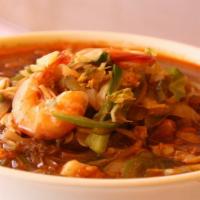 Zam Pong (짬뽕) · Home-made noodles with shrimp, squid, clam, and vegetables in spicy beef broth soup.