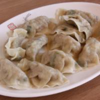 Boiled Pot Stickers (12 pieces) | 물만두 · Homemade poached pot stickers stuffed with pork and vegetables.