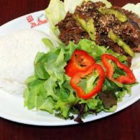 Bulgogi (불고기) · Tender beef marinated in our house special sauce with steamed rice.