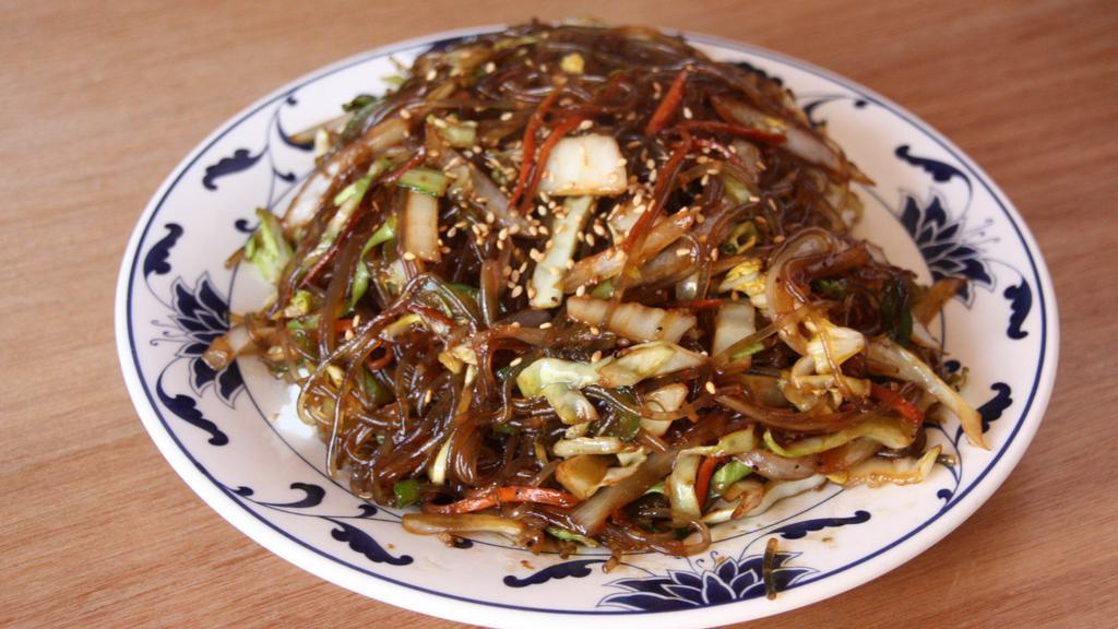 Jap Chae Bap with Beef | 잡채밥 · Stir fried clear yam noodles with beef and vegetables over steamed rice.