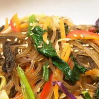 Veggie Jhap Chae · Sweet potato glass noodles. Stir-fried with mushrooms, julienned carrots, onion, spinach, an...