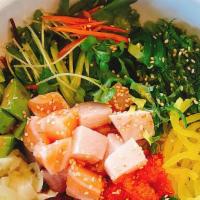 Poke Bowl · Mixed greens, wakame, cucumber, tamago, avocado, tobiko, pineapple over rice