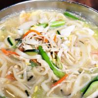 Korean Noodle Soup · Thick flour noodle soup with vegetables and egg.