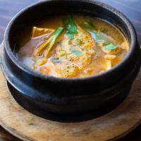 Korean Miso Stew · Soybean paste-based. With tofu, calamari, shrimp, and mussels.