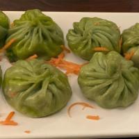 Veggie Momo · Vegetarian. Eight homemade and wrapped Nepalese potstickers, filled with paneer and vegetabl...