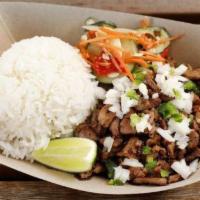 Sisig with Steamed Rice · Topped with diced onions, diced jalapeños and a side of achara.