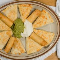 Fiesta Platter · A sampler of 2 quesadillas, 2 flautas, sour cream and guacamole on the side.