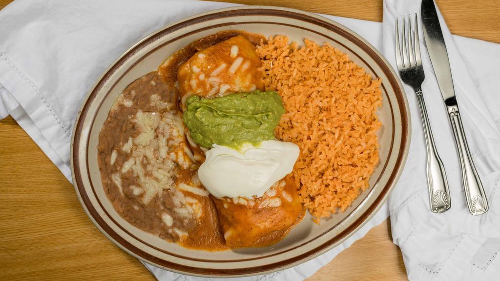 El Amigo Burrito Supreme Chicken · Our large burrito filled with lettuce, cheese, refried beans, rice and shredded chicken and topped with sour cream, guacamole and sauce and cheese. Accompanied with rice, beans and a side salad.