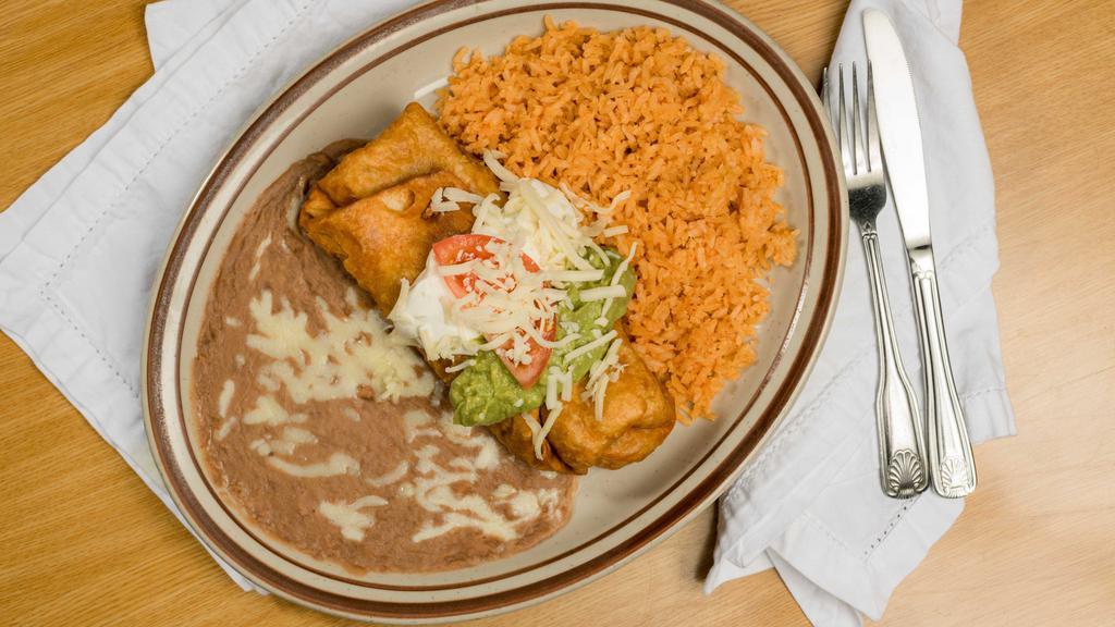 Chimichanga · Fried burrito filled with your choice of meats: chicken, chile colorado, chile verde or vegetarian and with beans and topped with sour cream and guacamole