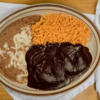Chicken Mole · Chicken breast cooked in our special chocolatey sauce. Choice of flour or corn tortillas