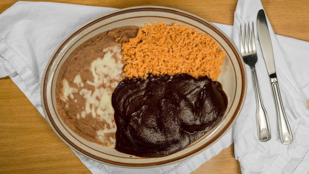 Chicken Mole · Chicken breast cooked in our special chocolatey sauce. Choice of flour or corn tortillas