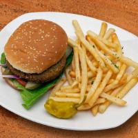Falafel Burger · (Vegetarian) Served with hummus, salad, and fries.
