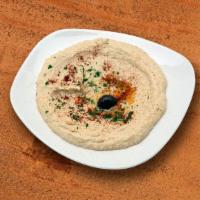 Hummus · Vegan, gluten free. A delightful dish whipped garbanzo beans mixed with garlic, lemon juice,...