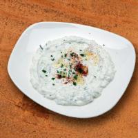 Tzatziki · (Vegetarian) (Gluten free) Plain yogurt with diced cucumbers, oregano, parsley, and a hint o...