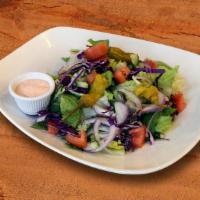 House Salad · (Vegetarian) (Gluten free) Romaine lettuce, tomatoes, cucumber, and onions. Served with pita...