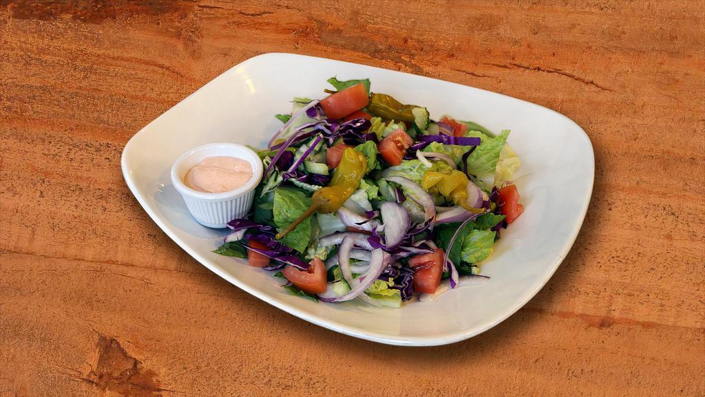 House Salad · (Vegetarian) (Gluten free) Romaine lettuce, tomatoes, cucumber, and onions. Served with pita bread.