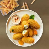 Hola Jalapeno  · Six pieces crispy golden breaded jalapeños stuffed with creamy cheese and served with a mari...