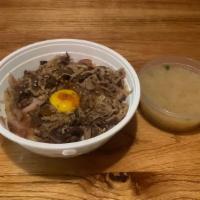 Beef Don · Served with miso soup. Stirred beef with onion served over rice and topped with egg yolk and...