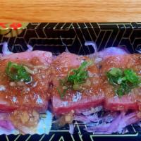 Wagyu Beef Tataki · (6 pieces) lightly seared Kobe beef with DJ  signature sauce.