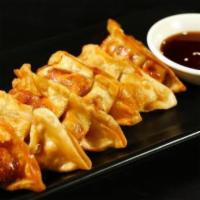 Gyoza (6 Pieces) · Deep-fried chicken dumplings with ponzu sauce.