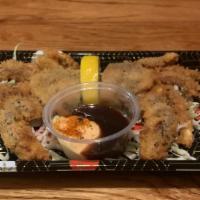 Soft Shell Crab · Two halves with spicy mayo and katsu sauce.