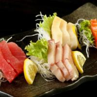 Sashimi Combo (12 Pieces) · Tuna, walu, salmon, and hamachi.