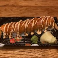 Tiger Roll · Avocado, cucumber, and shrimp tempura topped with salmon and spicy mayo.