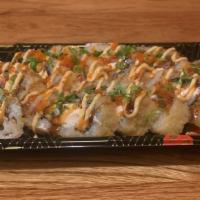 Giant Roll · Deep fried salmon, cream cheese, and jalapeno topped with unagi sauce, spicy mayo and tobiko.