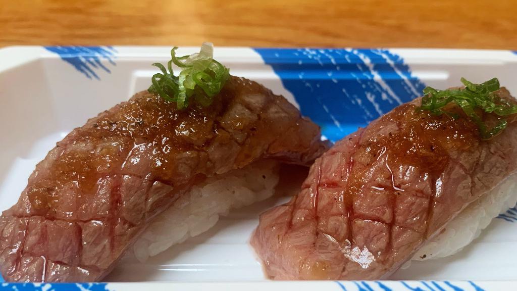 Kobe Beef Sushi · 2 pieces lightly seared Wagyu Beef nigiri with DJ signature sauce.