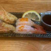 Ama Ebi Nigiri (2 Pieces) · (2 pieces) Sweet raw shrimp with Tobiko, served with side of deep fried heads.