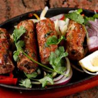 10. Lamb Seekh Kabab · Minced lamb, onions, chili, herbs, spices skewered baked in tandoor.