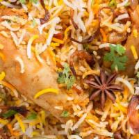 16. Chicken Biryani · Basmati fried rice with chicken, herbs, and spices.