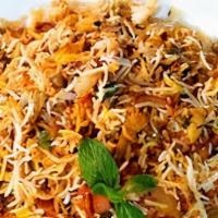 15. Veggie Biryani · Basmati fried rice with mixed vegetables, herbs, and spices.