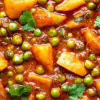 25. Aloo Mattar · Peas, potatoes cooked in curry sauce herbs and spices.